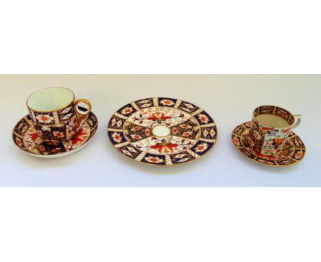 A quantity of Royal Crown Derby to include a plate and two cups and saucers, marks to the bases (5)