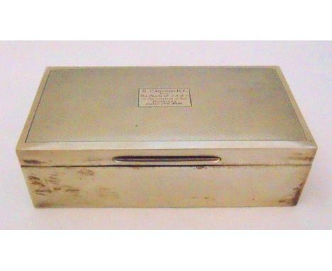 A hallmarked silver rectangular presentation engine turned cigarette box with hinged cover and cedar wood lining, Birmingham 