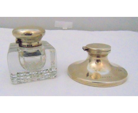 A hallmarked silver capstan inkwell, Birmingham 1930 and a square glass inkwell with hallmarked silver mounts and hinged cove