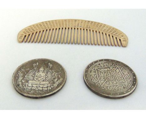 Two Chinese white metal coins and Chinese white metal Buddhist Sutra comb