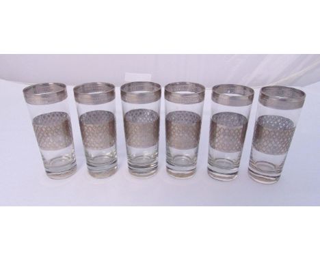 A set of six overlaid silver highball drinking glasses of tapering cylindrical form