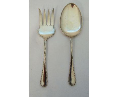 A pair of hallmarked silver salad servers with zigzag borders, Sheffield 1918, approx total weight 192g