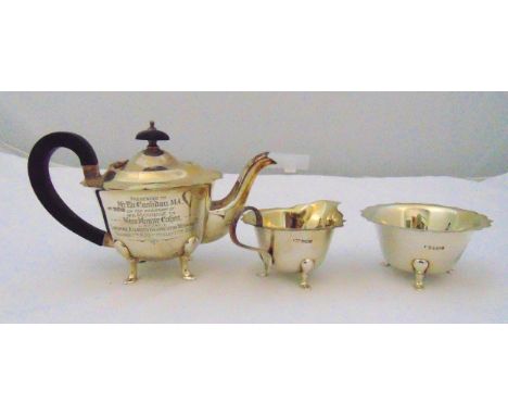 An Edward Viner hallmarked silver three piece teaset of circular form with ebonised wooden handle and presentation inscriptio