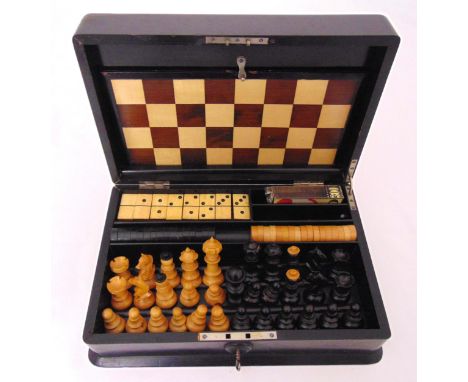 A Victorian ebonised rectangular wooden cased games compendium of games to include chess, draughts and dominoes, circa 1886