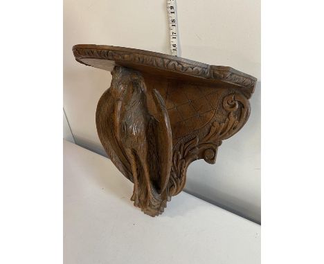 A hand carved wooden shelving bracket depicting a phoenix? 36x40cm, shipping unavailable