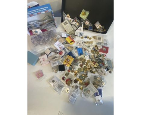 A job lot of assorted enamel badges, shipping unavailable
