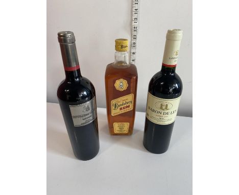 Two bottles of red wine and a bottle Bundaberg rum, shipping unavailable