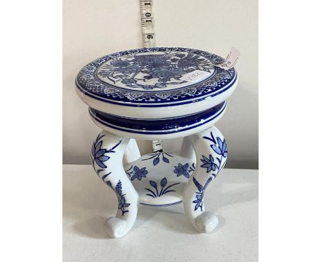 A ceramic blue and white planter stand, shipping unavailable