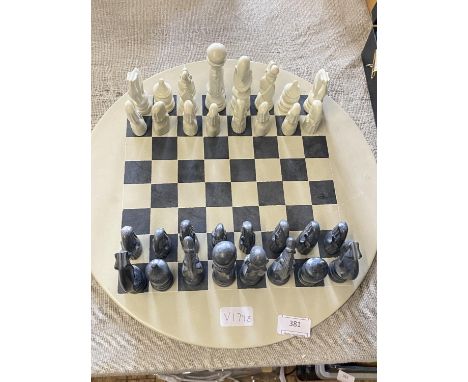 A novelty hardstone chess set on board complete, shipping unavailable