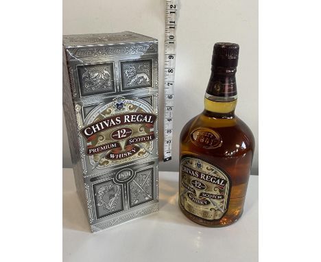 A sealed and boxed bottle of 12 year old Chivas Regal whiskey 1 litre 