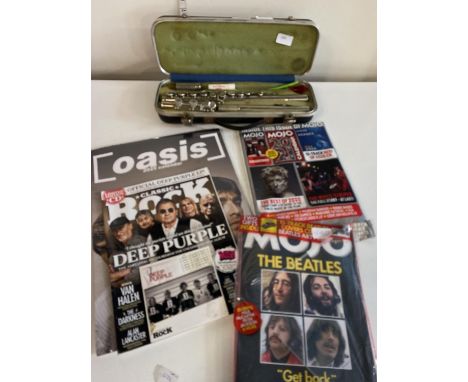 A cased Boosey and Hawkes Regent flute and music related magazines 