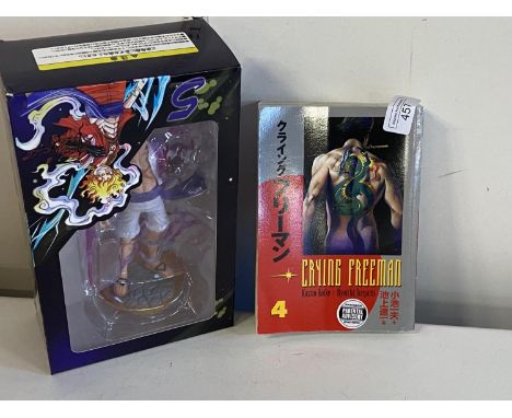 A Japanese themed figurine and comic book, shipping unavailable