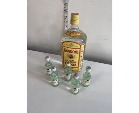 A 1.125L bottle of Gordons Dry Gin and five miniature bottles of Bacardi 