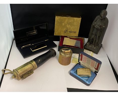 A selection of novelty lighters including a Knight table lighter 