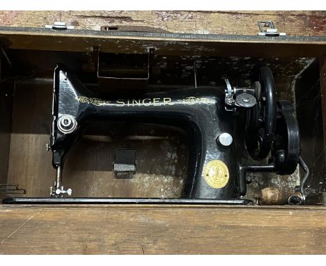 A cased Singer sewing machine, shipping unavailable