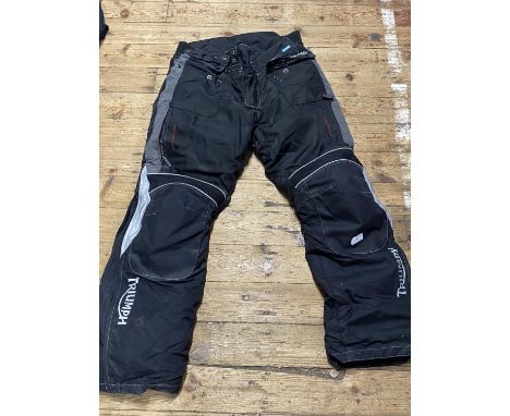 A pair of Triumph motorbike trousers size XL 