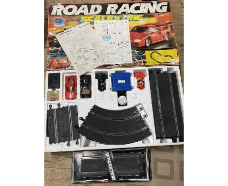 A boxed Scalextric set with spare track in working order, shipping unavailable