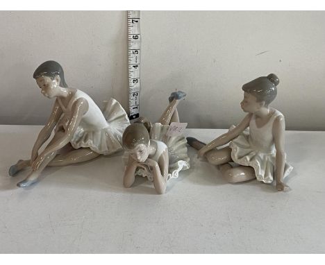 Three Nao ballerina figures, shipping unavailable
