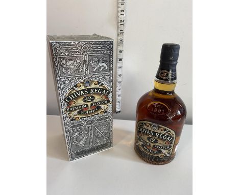 A sealed and boxed bottle of 12 year old Chivas Regal whiskey 1 litre 