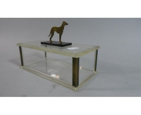 A Perspex Lidded Sarcophagus Shaped Box with Brass Mounts and Dog Finial, 19cm wide 