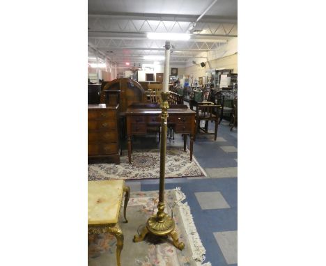 A Gilt Tripod Standard Lamp with Turned Support Covered in Velvet 