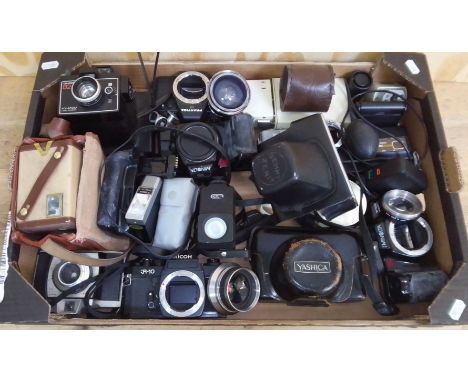 A box of mixed cameras including Ricoh KR10, Minolta, Yashica, etc  