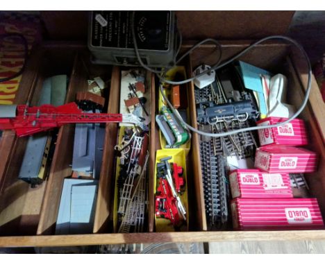 A box of Hornby Dublo model railway items including boxed rolling stock, one locomotive, carriage, track, original transforme