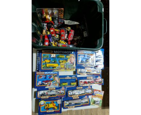 A box of die cast model vehicles, mostly boxed Matchbox.  