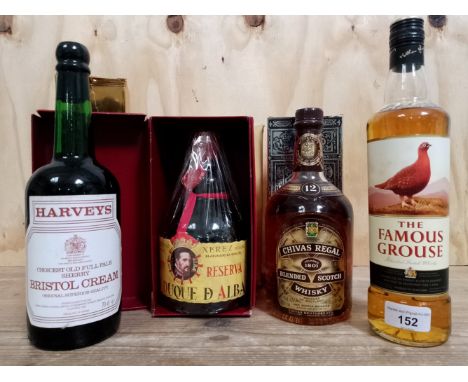 A mix lot of alcohol comprising Chivas Regal 12 year old Scotch whisky 750ml, Famous Grouse Scotch whisky 70cl, Gran Duque D'