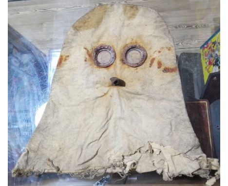 A WWI PH helmet gas mask hood respirator.Condition:- General wear through age and use, rust to goggles, part broken off, some