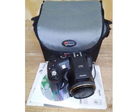 A Fujifilm FinePix camera, model S7000, with case, memory card, instructions, cable etc.  