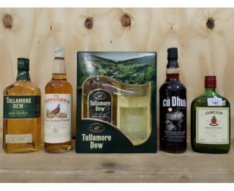 Five bottles of whisky; two 70cl bottles of Tullamore Dew Irish whisky (one in presentation box with glasses), Cu Dhub single