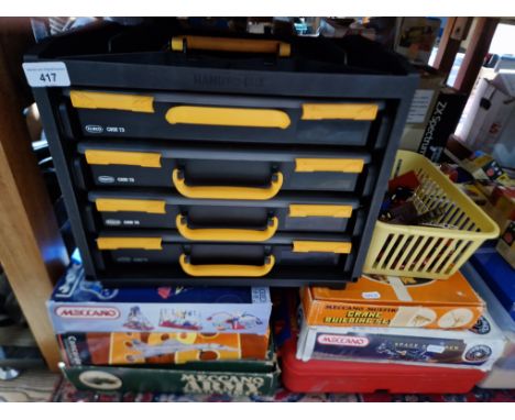 A quantity of boxed Meccano sets and some Lledo model vehicles.  