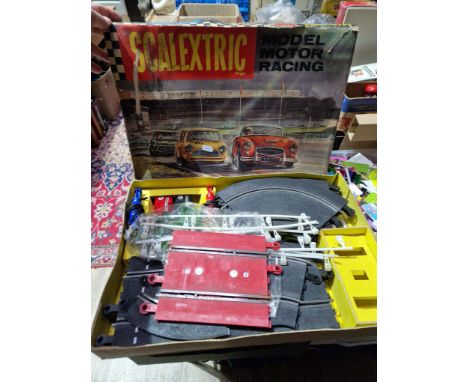 A vintage Scalextric model motor racing game, set 33.Codition:- Untested, sold with no guarantee.