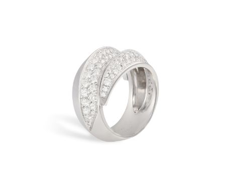 A DIAMOND 'COUP D'ECLAT' DRESS RING, BY CARTIER Designed as a coiled knife-edge band, pavé-set with brilliant-cut diamonds, m