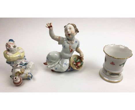 MEISSEN FIGURE OF BOY, 16cm H, a man with pipe, 11cm H and an urn, 9cm H. (3)