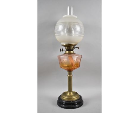 A Late Victorian Oil Lamp with Ribbed Brass Support, Coloured Glass Reservoir and Etched Globe Shade, Dual Controls 