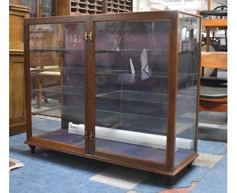 A Vintage Glazed Shop Cabinet by Sage &amp; Co., London with Eight Glazed Shelves, One AF and Crack to top Glass, 119cm wide 