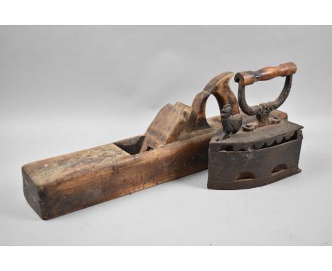 A Vintage Wooden Jack Plane and a Large Metal Flat Iron 