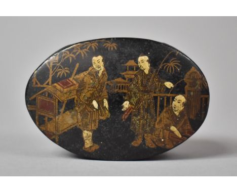 An Oval Lacquered Snuff Box, the Hinged Lid Decorated with Oriental Figures in Gilt and Ivory, 7.25cm long 