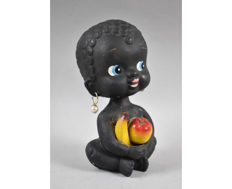 A Vintage Novelty Nodding Head Money Box in the Form of Seated Child Holding Fruit, 18cm high 