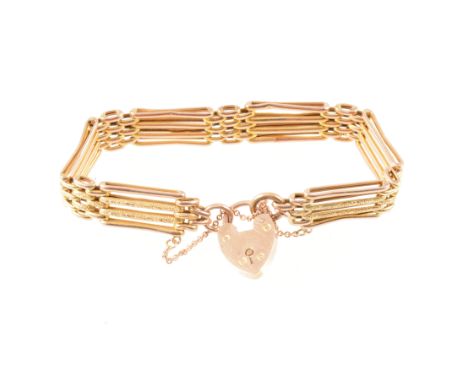 A rose metal four bar gate link bracelet, the inner bars chased and outer bars polished, marked 9c, 10mm wide, fitted with a 