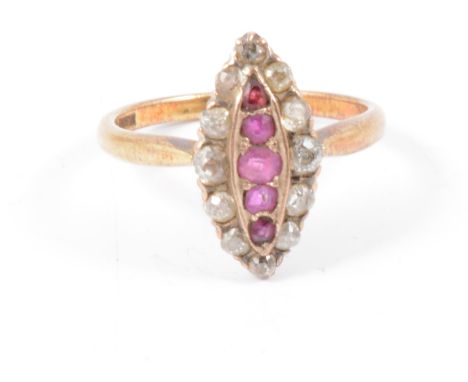 A ruby and diamond marquise cluster ring, five rubies and twelve old cut diamonds claw set in a yellow and white metal mount,