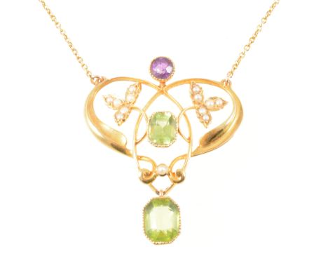 A Suffragette pendant, the yellow metal open framework pendant marked 15ct is set with a single amethyst to the top, central 