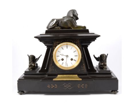 French black slate presentation mantel clock, in Egyptian revival style, with bronzed sphinges, white enamelled dial, cylinde