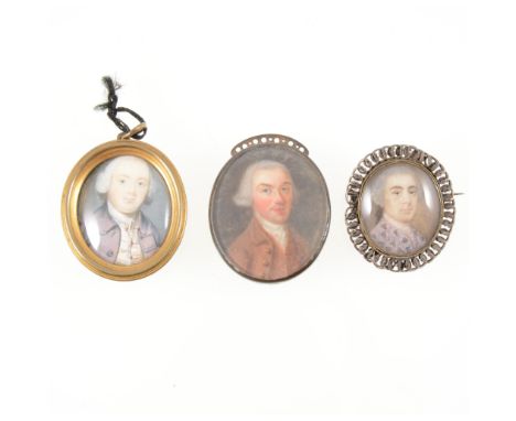 Three oval portrait miniatures of Georgian gentlemen, all in metal mounts, one with a brooch fitting, portrait sizes 35mm x 3
