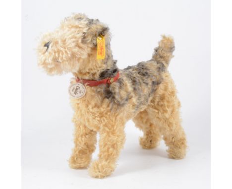 Steiff 1935 Classic Fellow, terrier dog with ear button and tag, 26cm tall, 31cm long.