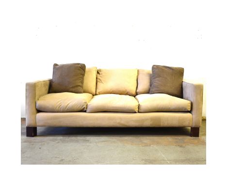 A contemporary three-seater sofa, pale pink upholstery, stained wood block supports, width 220cm, depth 100cm