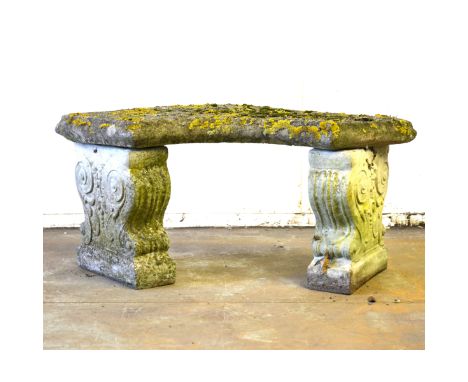 Haddonstone style curved garden bench, scrolled supports, 112cm; three similar; and a similar bench with a rectangular top. (
