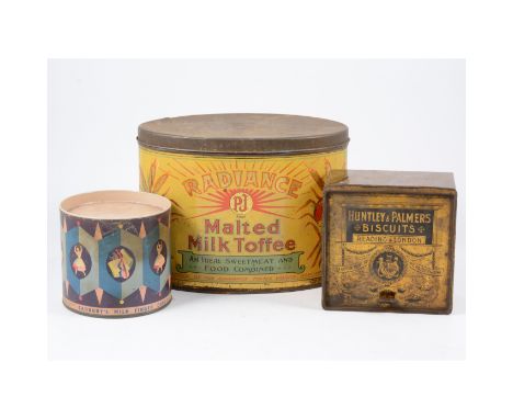 A large tin trunk containing advertising tins and vintage games.